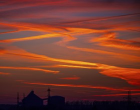 Sunset with red-coloured sky and contrails, Braunschweig, Lower Saxony, Germany, Europe