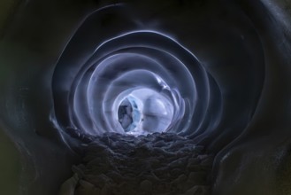 HINTERTUX, AUSTRIA, SEPTEMBER 10, 2023, A narrow path in a natural glacial ice cave