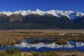 Reflection of snow mountains on lake in Glenorchy, South Island, New Zealand, Oceania