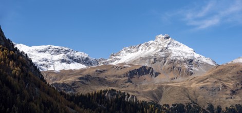 Scenic view of the Arblatsch mountain in the Swiss alps, seen from lake Marmorera
