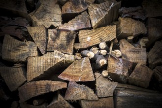 Lumber of various sizes stacked as a spare for the winter
