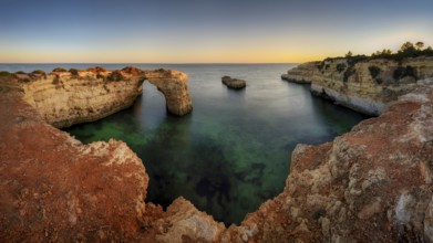 Praia de Estaquinha, Portuguese coast near the city of Lagos in the light of the setting sun