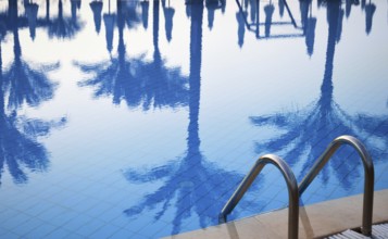 Swimming pool in touristic resort during summer time