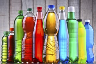 Plastic bottles of assorted carbonated soft drinks in variety of colors