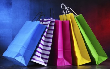 Composition with colorful paper shopping bags