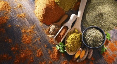 Composition with spices on wooden kitchen table