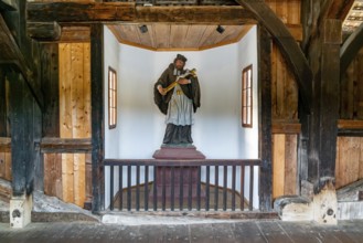 Germany - 4 July 2020: statue in the interior of the historic covered wooden bridge in Bad