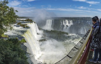 Foz do Iguacu, Brazil, july 9, 2016: Cataratas waterfalls view from the top with some rocks covered