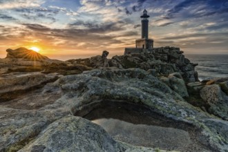 A beautiful sunset at the Punta Nariga lighthouse in Galicia