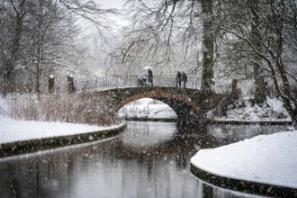 Copenhagen, Denmark, January 06, 2021: People enjoying a snowy winter day in Frederiksberg Gardens,