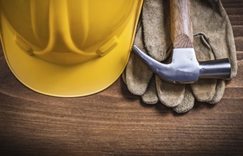 Claw hammer building helmet protective gloves construction concept