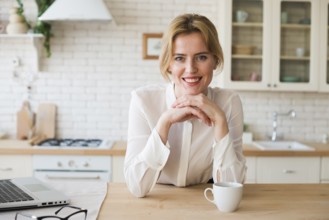 Business woman sitting with coffee cup laptop