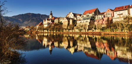 Frohnleiten panorama small city above Mur river in Styria, Austria. View at Parish church, town and