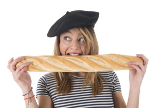 Young French girl with typical French barret and striped shirt eating bread isolated over white