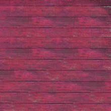 Pink painted wooden boards creating a weathered, rustic background texture, ideal for design