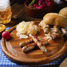Rustic Thuringian bratwurst with sauerkraut and roll