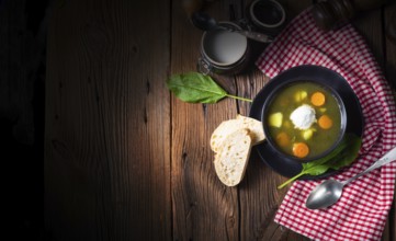 Rustic sorrel soup with potatoes and cream