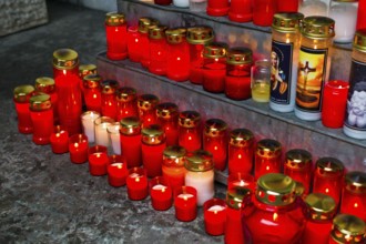 Many grave lights on All Saints' Day shine in a cemetery in Austria