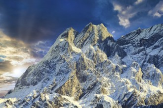 Towering snow-capped mountains in the light of a dramatic sunset, Rosenlaui Gorge, Bernese