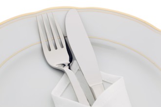 A knife with fork and plate. Place setting for a dinner in a restaurant. Austria