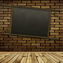 Old bamboo blackboard on the brick wall