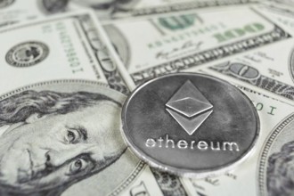 Silver Ethereum macro photo on hundred dollars bills
