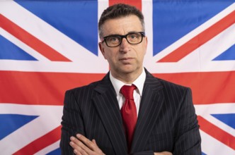 English UK businessman with suit on british flag