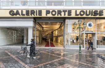 Brussels Old Town, Brussels Capital Region, Belgium, 12 12 2019 Woman with bicycle and pedestrians