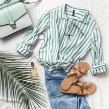 Feminine summer fashion composition: striped blouse, slippers, bag, sunglasses, watch, perfume,