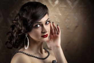 Retro woman portrait. Luxurious lady in the vintage style of the 20s or 30s