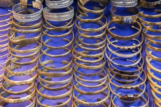 Golden bracelets in a shop in a souk in Marrakech. Morocco