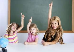Kids student clever girls group in classroom raising hand finger