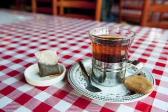 Cup of tea with a cookie in a restaurant