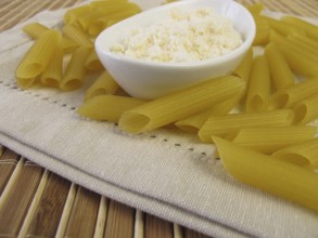 Gluten-free penne pasta and grated cheese