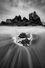 A dramatic sunset seascape at a northern California beach in black and white. USA