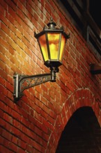 Lantern on the red brick wall