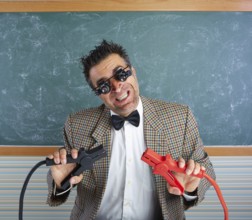 Nerd electronics technician retro teacher silly expression working battery clamps