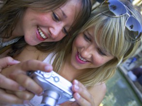 Two woman taking a selfie with the camera, Barcelona, Spain, Europe