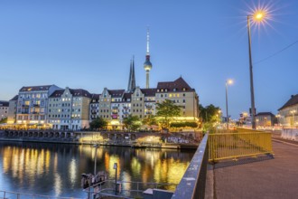The Nikolai quarter, the Spree and the television tower in Berlin at dusk