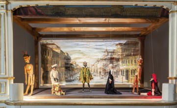 Vintage puppet show theatre made of wood. Old historical puppets