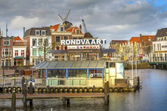 Leiden, Netherlands, April 7, 2016: Panorama with traditional dutch houses, harbour at canal and