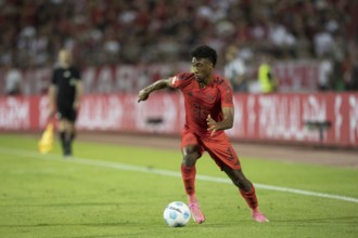 Football match, Kingsley COMAN FC Bayern Munich leading the ball to the left, football stadium