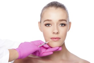 Beautiful face lip filler collagen injection Cosmetic spa beauty treatment with pink gloves, on