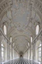 Magnificent, bright baroque corridor with ornately decorated ceiling, Palace of Venaria Reale,