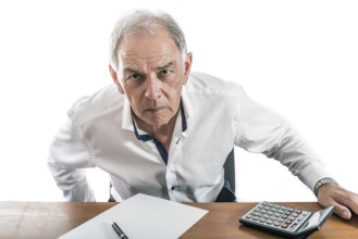 Man as civil servant, representative, lawyer or salesman looks grimly across the table