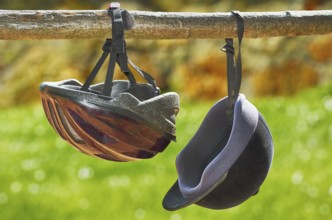 Two jockey helmets hanging from the beam Varna, Bulgaria, Europe