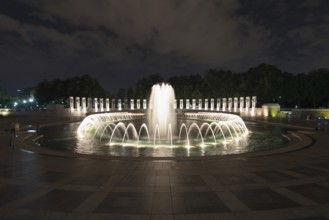 WASHINGTON, USA, AUGUST 12, 2022, Fountain at World War II memorial at night in Washington, USA,