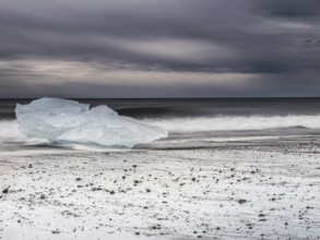 Diamond Beach, iceberg in the surf on the black lava beach, near Jökulsarlon glacier lagoon,