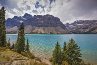 Banff National Park in the Canadian Rockies. The majestic mountain glacial Bow Lake with green