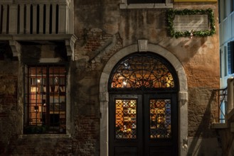 VENICE, ITALY, NOVEMBER 30, 2022, An old Book Store illuminated at Night, Venice, Italy, Europe